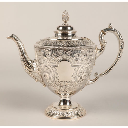 187 - Three piece silver plated tea service with embossed decoration.