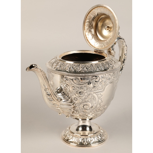 187 - Three piece silver plated tea service with embossed decoration.