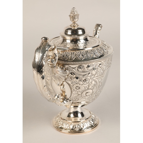 187 - Three piece silver plated tea service with embossed decoration.