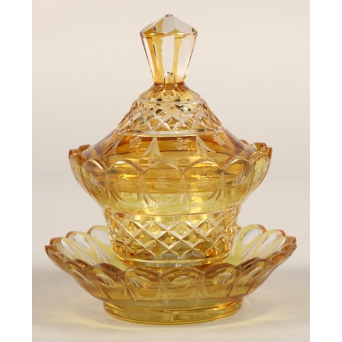 239 - Bohemian amber glass preserve jar, cover and saucer, 22cm high.