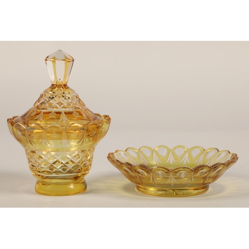 239 - Bohemian amber glass preserve jar, cover and saucer, 22cm high.