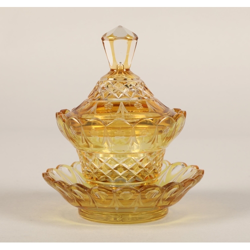 239 - Bohemian amber glass preserve jar, cover and saucer, 22cm high.