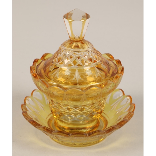 239 - Bohemian amber glass preserve jar, cover and saucer, 22cm high.