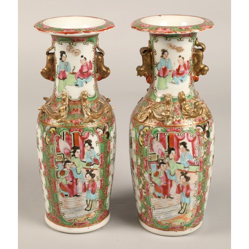 205 - Pair of Canton vases, of baluster form, with panels of figures, birds, butterflies and flowers, with... 