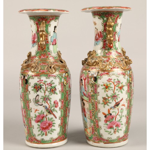 205 - Pair of Canton vases, of baluster form, with panels of figures, birds, butterflies and flowers, with... 