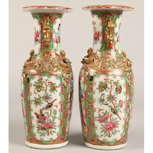 205 - Pair of Canton vases, of baluster form, with panels of figures, birds, butterflies and flowers, with... 