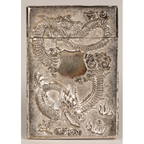 195 - Chinese silver embossed card case, embossed with a coiled dragon on one side and bamboo shoots to th... 