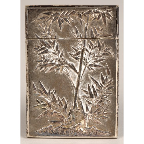 195 - Chinese silver embossed card case, embossed with a coiled dragon on one side and bamboo shoots to th... 