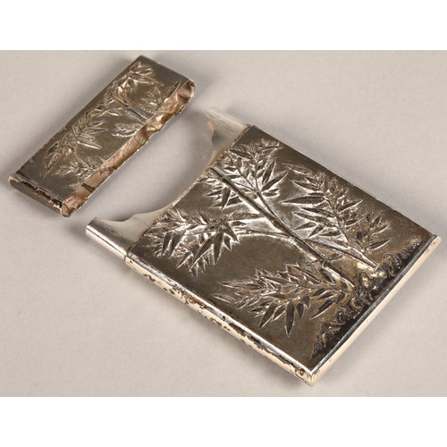 195 - Chinese silver embossed card case, embossed with a coiled dragon on one side and bamboo shoots to th... 