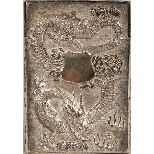 195 - Chinese silver embossed card case, embossed with a coiled dragon on one side and bamboo shoots to th... 