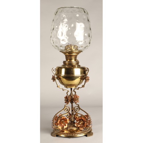 251 - Oil lamp with copper and brass foliate decoration on the base, 62 cm high including glass shade