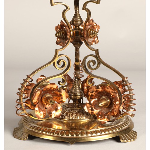 251 - Oil lamp with copper and brass foliate decoration on the base, 62 cm high including glass shade