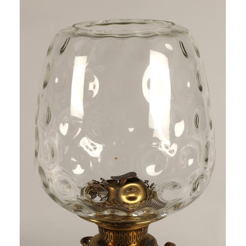 251 - Oil lamp with copper and brass foliate decoration on the base, 62 cm high including glass shade