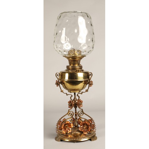 251 - Oil lamp with copper and brass foliate decoration on the base, 62 cm high including glass shade