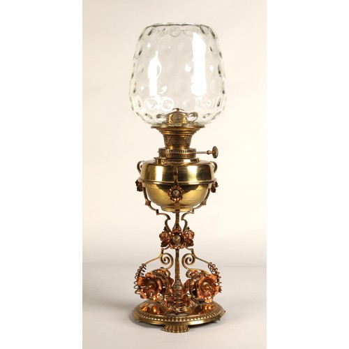 251 - Oil lamp with copper and brass foliate decoration on the base, 62 cm high including glass shade