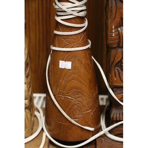 102 - Wooden totem form table lamps, largest 79cm high.