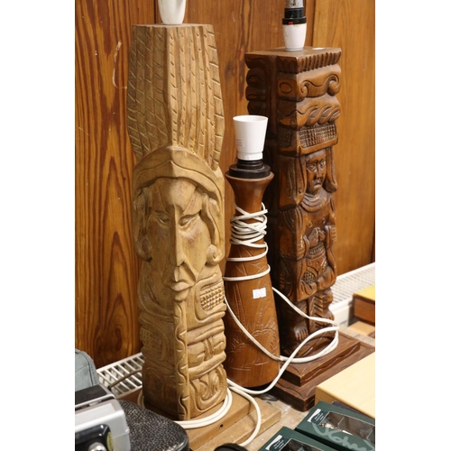 102 - Wooden totem form table lamps, largest 79cm high.