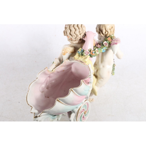 118 - Porcelain model of two cherubs pulling a basket, 30cm long.  (a/f)