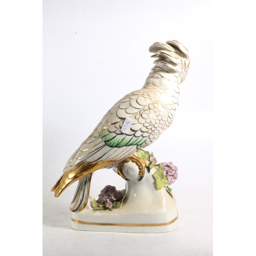 119 - Continental porcelain figurine of a cockatoo, 29cm high.