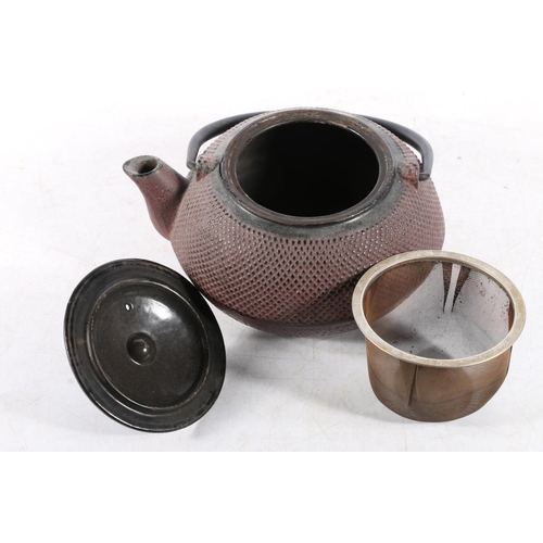 128 - Japanese patinated metal teapot, 17cm high to top of loop handle.