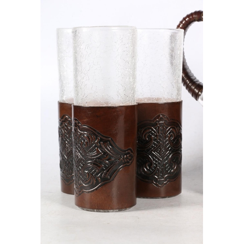 16 - Crackle glass lemonade set in leather holders.