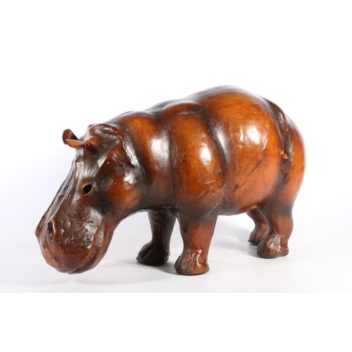 176 - Leather bound model of a hippopotamus in the manner of Liberty, 44cm long.