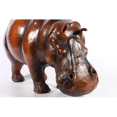 176 - Leather bound model of a hippopotamus in the manner of Liberty, 44cm long.