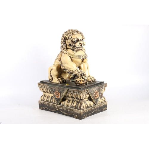 183 - Cast resin model of temple dog, 42cm high.