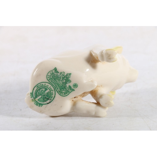 326 - Belleek pig with makers mark to base.