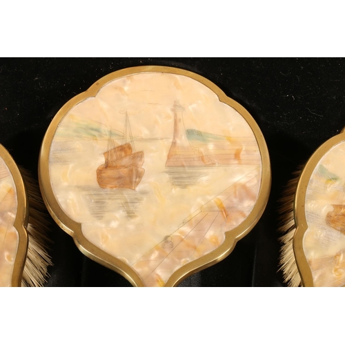 83 - Mother-of pearl backed dressing table set with etched harbour scenes in fitted case.