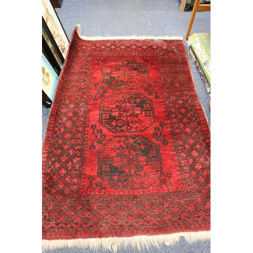 754 - Afghan deep red rug, 174cm x 120cm.