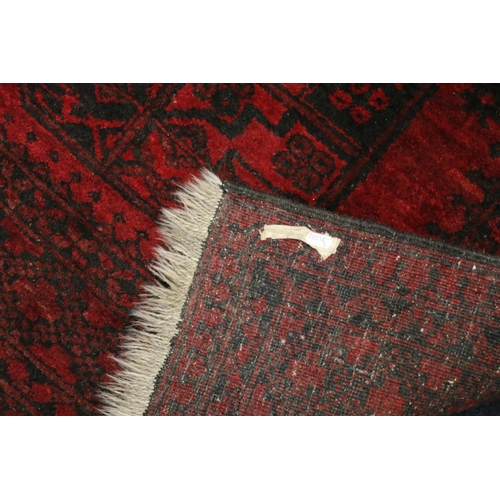 754 - Afghan deep red rug, 174cm x 120cm.