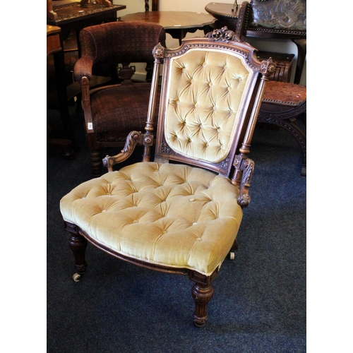 662 - Victorian mahogany lady's chair with button back and seat, raised on carved and fluted supports.