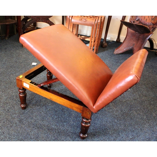 683 - Brown leatherette topped gout stool raised on mahogany base and turned supports.