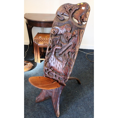 687 - African birthing chair decorated with lions, giraffes and other animals, 98cm high.