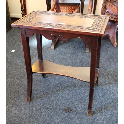 693 - Scottish style oak two-tier side table with repeating thorn design, 70cm wide.