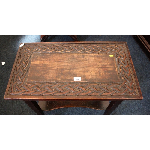 693 - Scottish style oak two-tier side table with repeating thorn design, 70cm wide.