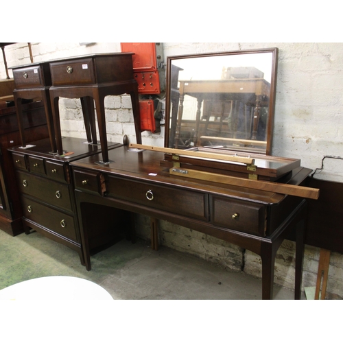 701 - Stag bedroom suite comprising dressing table, two bedsides and chest of drawers.