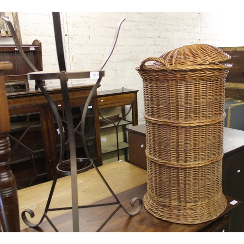 708 - Wrought metal plant stand and a tall wicker basket, largest 84cm.