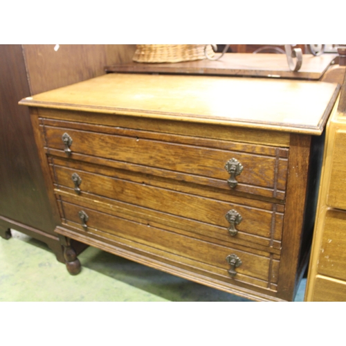 711 - 1920s oak chest of three drawers, 77cm high.