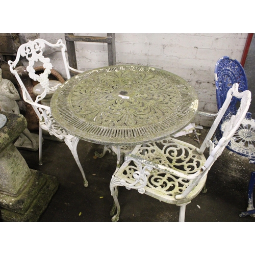 732 - Cast metal garden table and two matching white painted chairs.