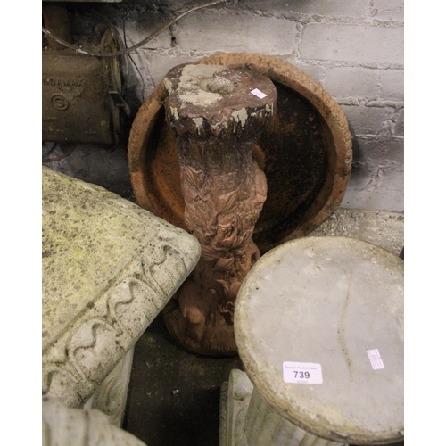 739 - Stoneware garden furniture to include an arch shaped bench raised on dolphin supports, a bird bath, ... 