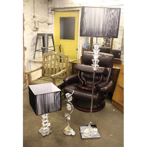 741 - Modernist free standing floor lamp formed of stepped glass and chrome and two similar table lamps.