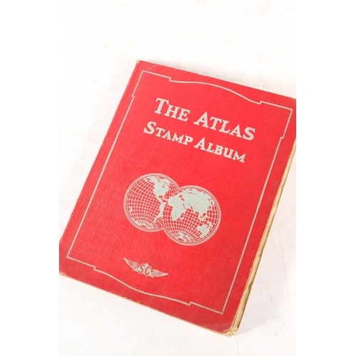 634 - Stamp collection held in one red covered Stanley Gibbons Atlas album to include GB 19th and 20th cen... 