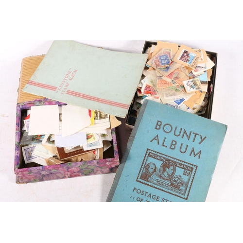 650 - Stamp collection held in two albums and two small boxes to include a Bounty Postage Stamps of the Wo... 