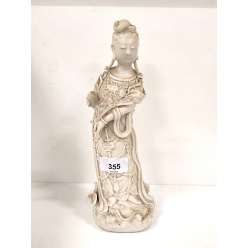 355 - Chinese blanc de chine figure modelled as the goddess Guanyin circa late 18th / early 19th century, ... 