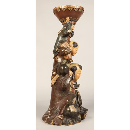 208 - Pair of Chinese pottery figure stands, each with a figure with two children on their shoulders suppo... 