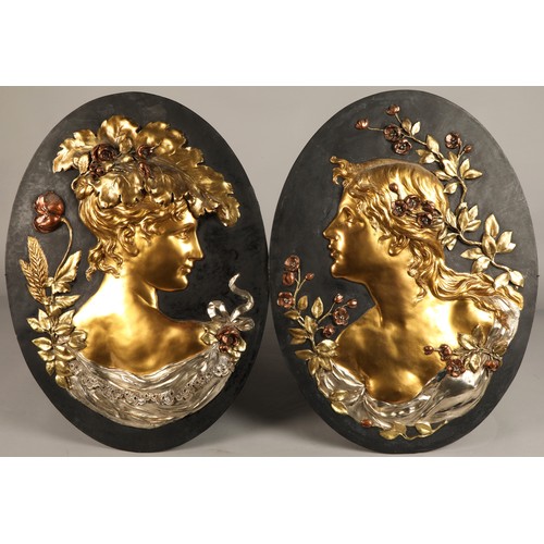 257 - Pair of oval Art Nouveau gilt metal figure bust wall plaques (possibly Glasgow School), 60 cm high, ... 