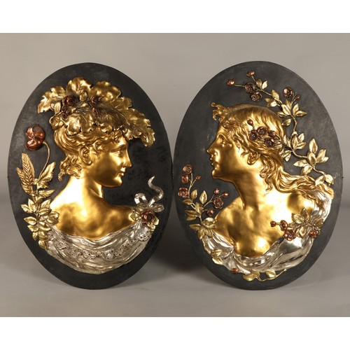 257 - Pair of oval Art Nouveau gilt metal figure bust wall plaques (possibly Glasgow School), 60 cm high, ... 