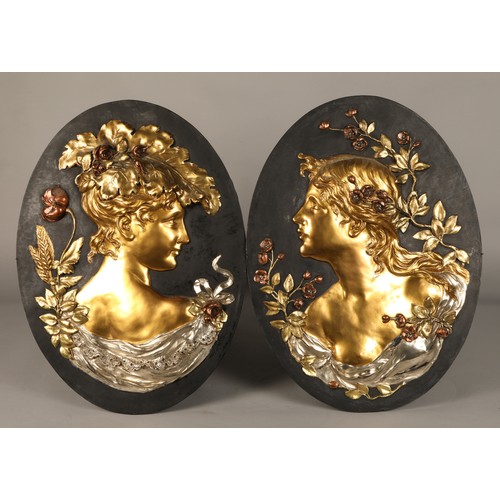 257 - Pair of oval Art Nouveau gilt metal figure bust wall plaques (possibly Glasgow School), 60 cm high, ... 